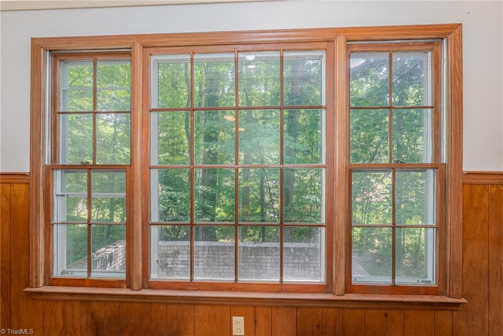 303 Kirk Road Greensboro, NC 27455 - Photo 9 of 26 Greatroom- see brick foundation outside to make porch and could replace this window with A nice french door!