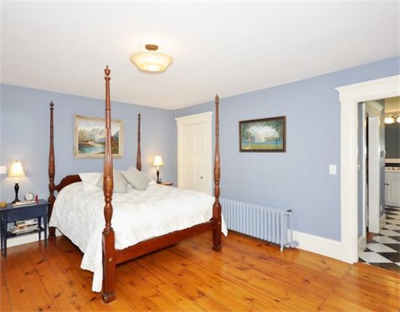 394 Littlefield Road Boxborough, MA 01719 - Photo 14 of 21 a bedroom with a bed and a chandelier