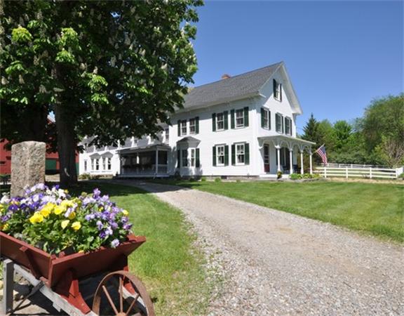394 Littlefield Road Boxborough, MA 01719 - Photo 6 of 21 a front view of a house with a yard