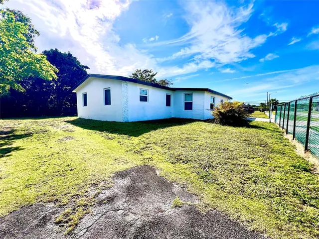 a view of a house with a big yard