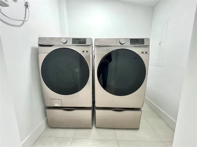 a utility room with dryer and washer