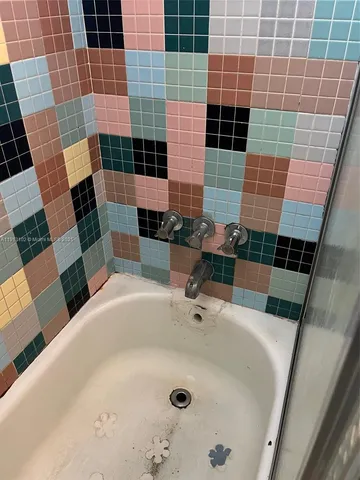 a bathroom with a sink and a shower