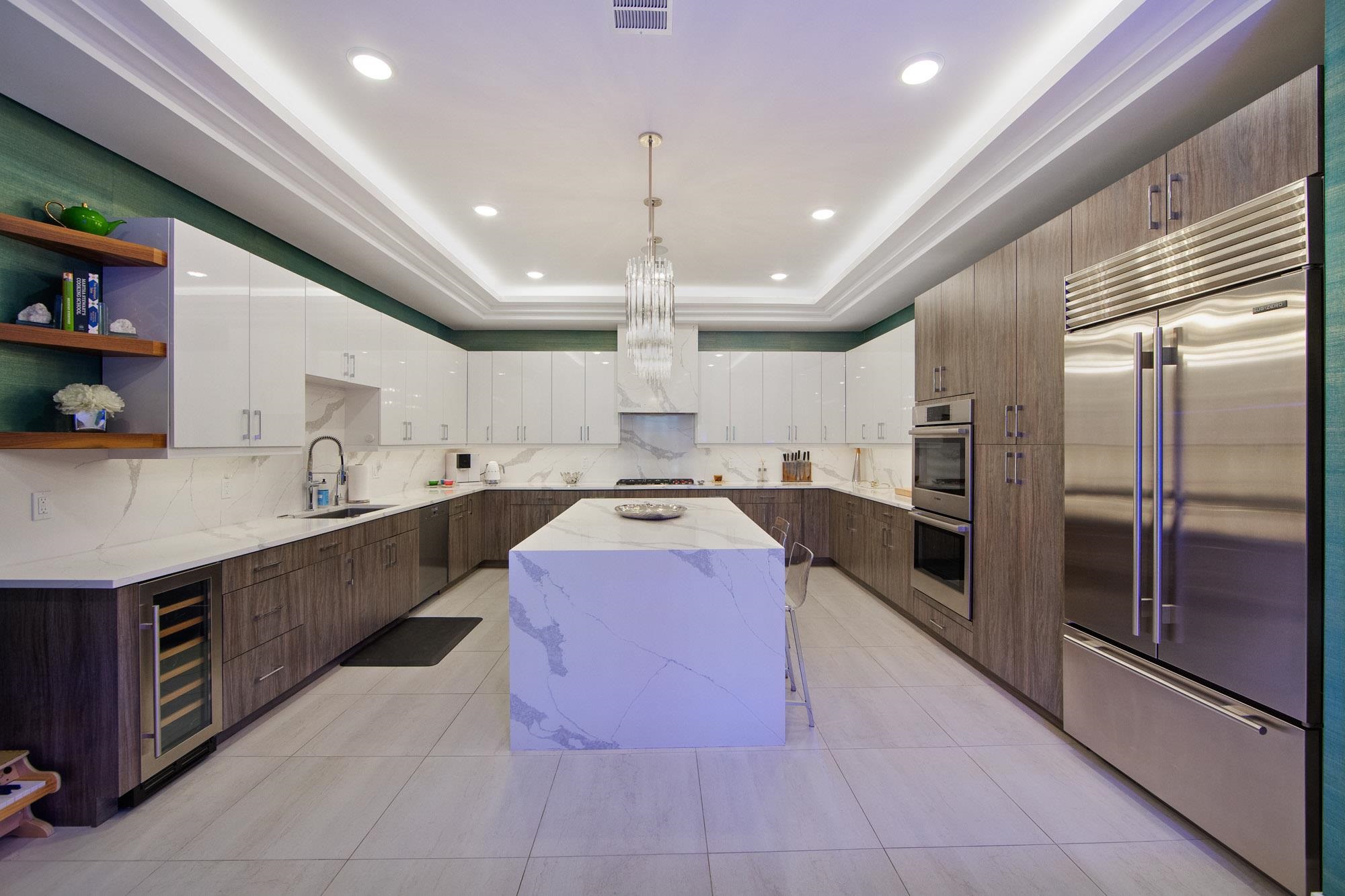 a large kitchen with stainless steel appliances kitchen island granite countertop a large counter top stainless steel appliances and cabinets