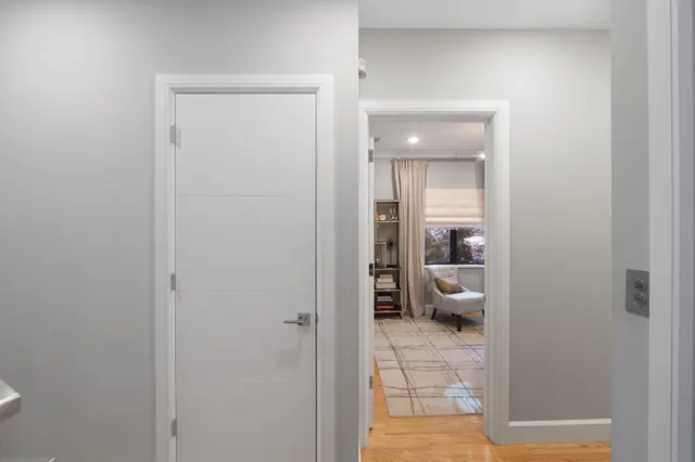 a view of a bathroom from a hallway