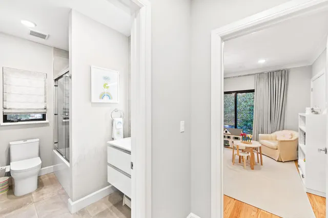 a dining room with furniture and a large window