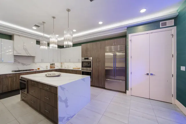 a kitchen with a sink stove and refrigerator
