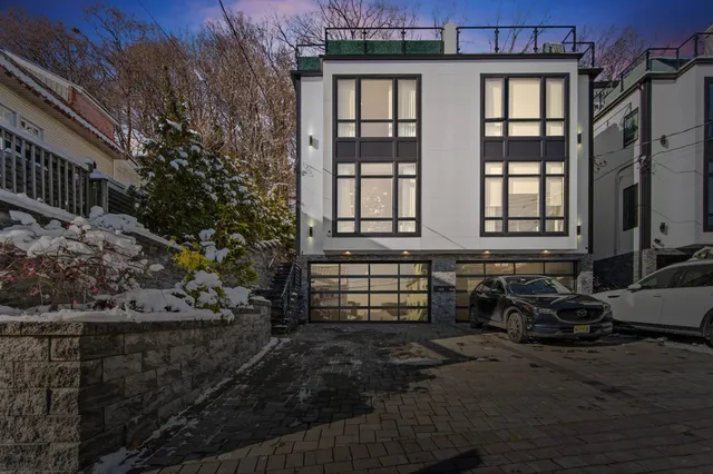 a front view of a house with outdoor seating