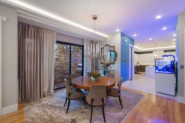 a dining room with furniture and window