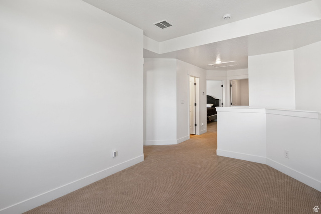 815 West Powderwood Lane Mapleton, UT 84664 - Photo 16 of 34 Carpeted open area with white walls and trim
