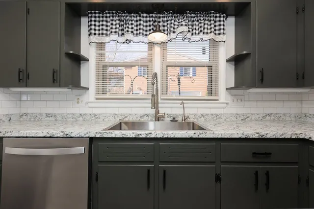 a kitchen with a sink and a window