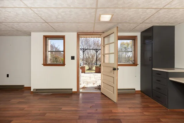 a view of a room with wooden walls