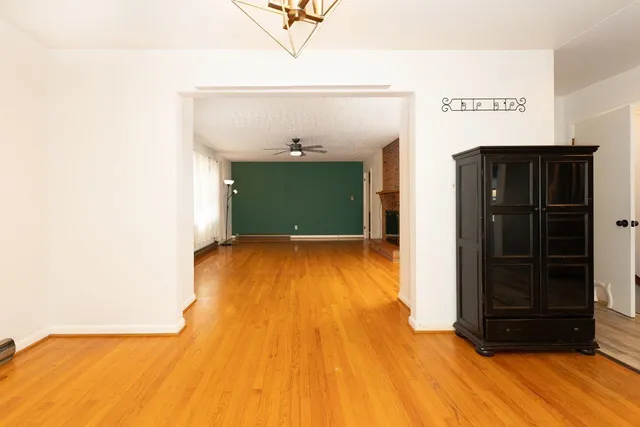 a kitchen with a sink cabinets stainless steel appliances and a window