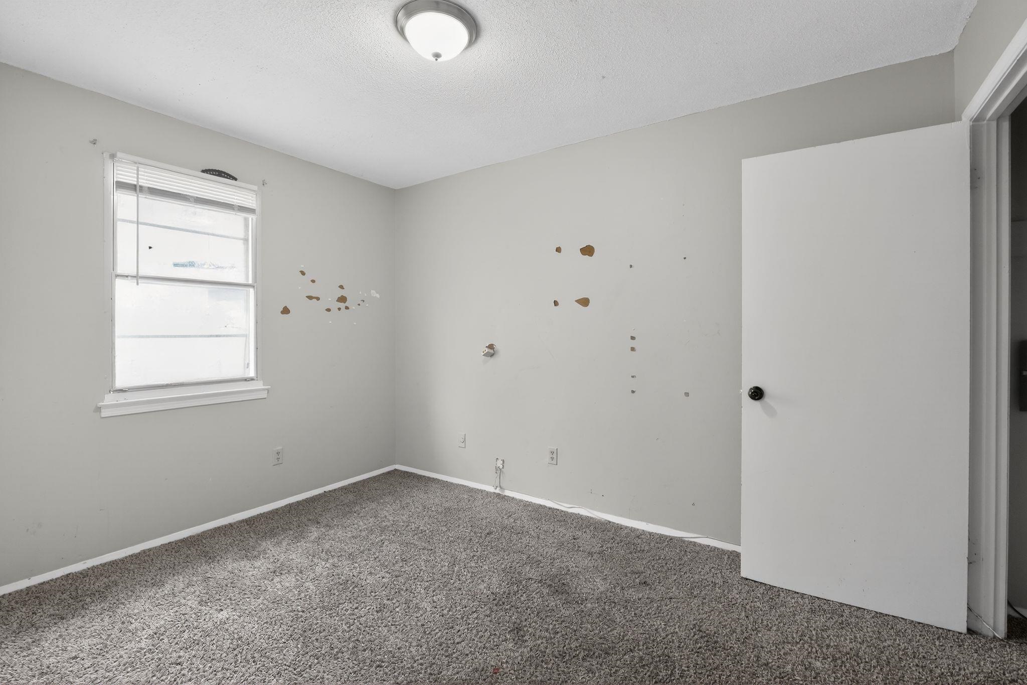 3420 Forrester Road Memphis, TN 38109 - Photo 15 of 30 Spare room featuring carpet and a textured ceiling