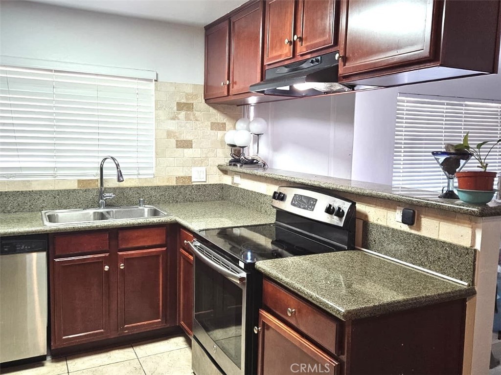 12805-18 Mapleview Street Lakeside, CA 92040 - Photo 3 of 28 a kitchen with a sink cabinets and window