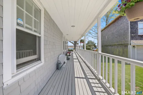 a view of balcony with wooden floor