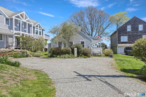 a pathway of a house with a yard