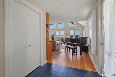 a dining room with furniture and a kitchen view