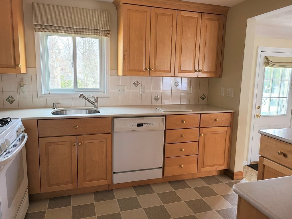1 Lexington Circle Canton, MA 02021 - Photo 13 of 41 a kitchen with a sink cabinets and window