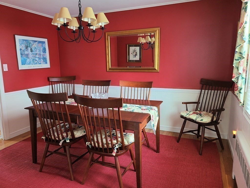 1 Lexington Circle Canton, MA 02021 - Photo 15 of 41 a view of a dining room with furniture wooden floor and a chandelier