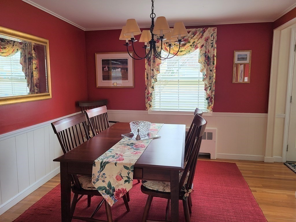 1 Lexington Circle Canton, MA 02021 - Photo 16 of 41 a view of a dining room with furniture and wooden floor