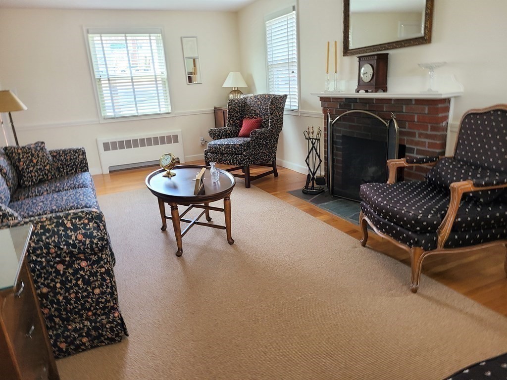 1 Lexington Circle Canton, MA 02021 - Photo 19 of 41 a living room with furniture and a fireplace