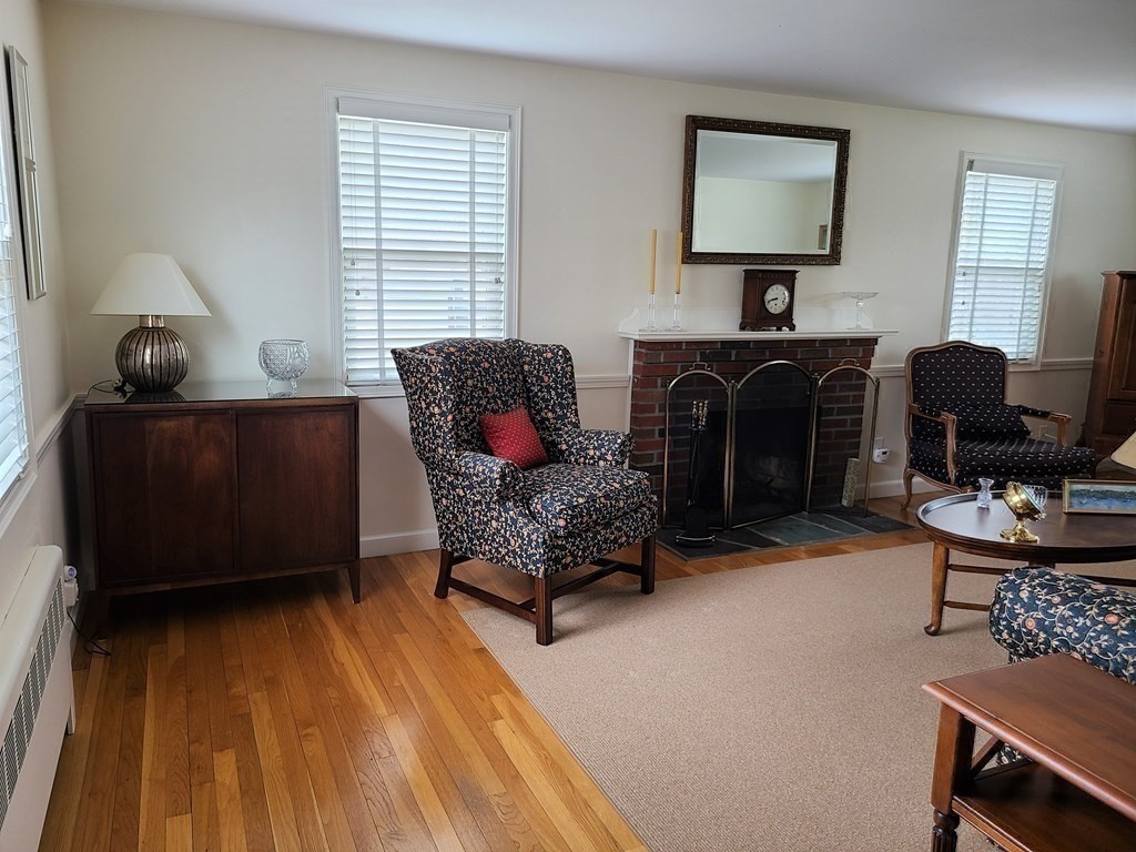 1 Lexington Circle Canton, MA 02021 - Photo 20 of 41 a living room with furniture and a fireplace