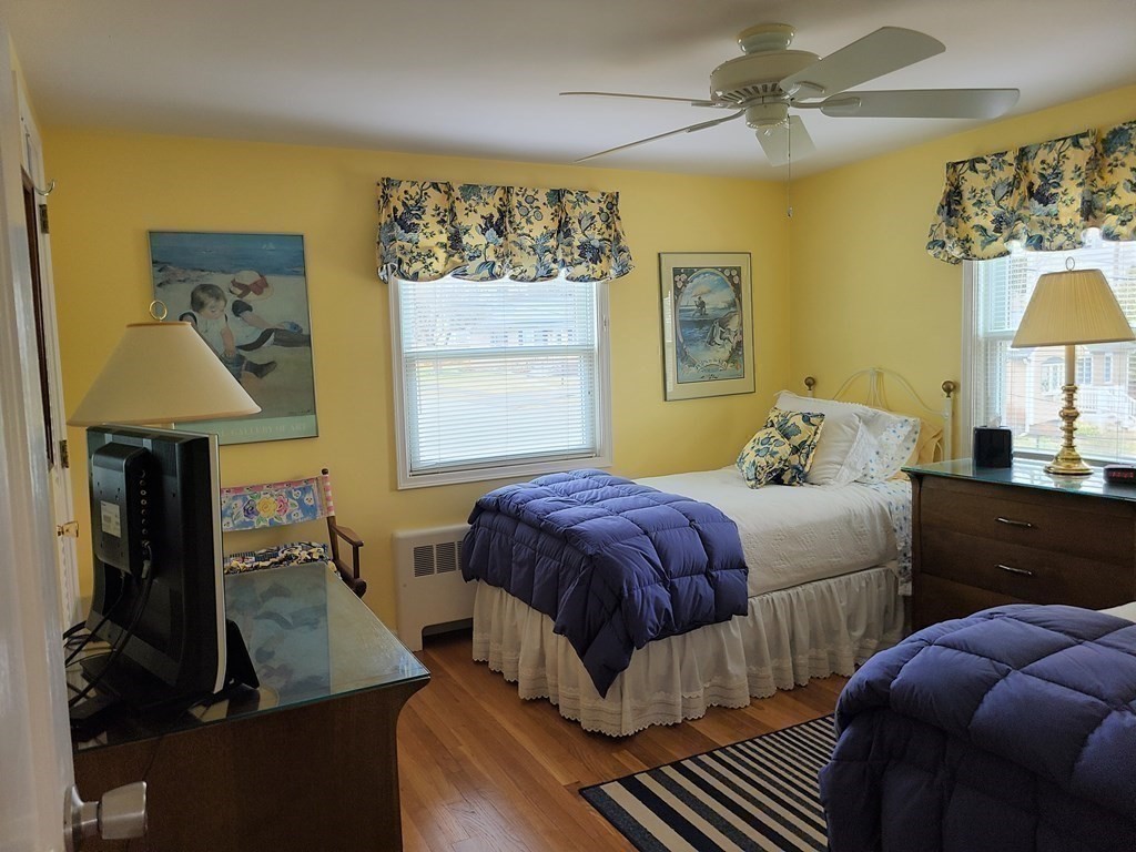 1 Lexington Circle Canton, MA 02021 - Photo 25 of 41 a bedroom with a bed and wooden floor