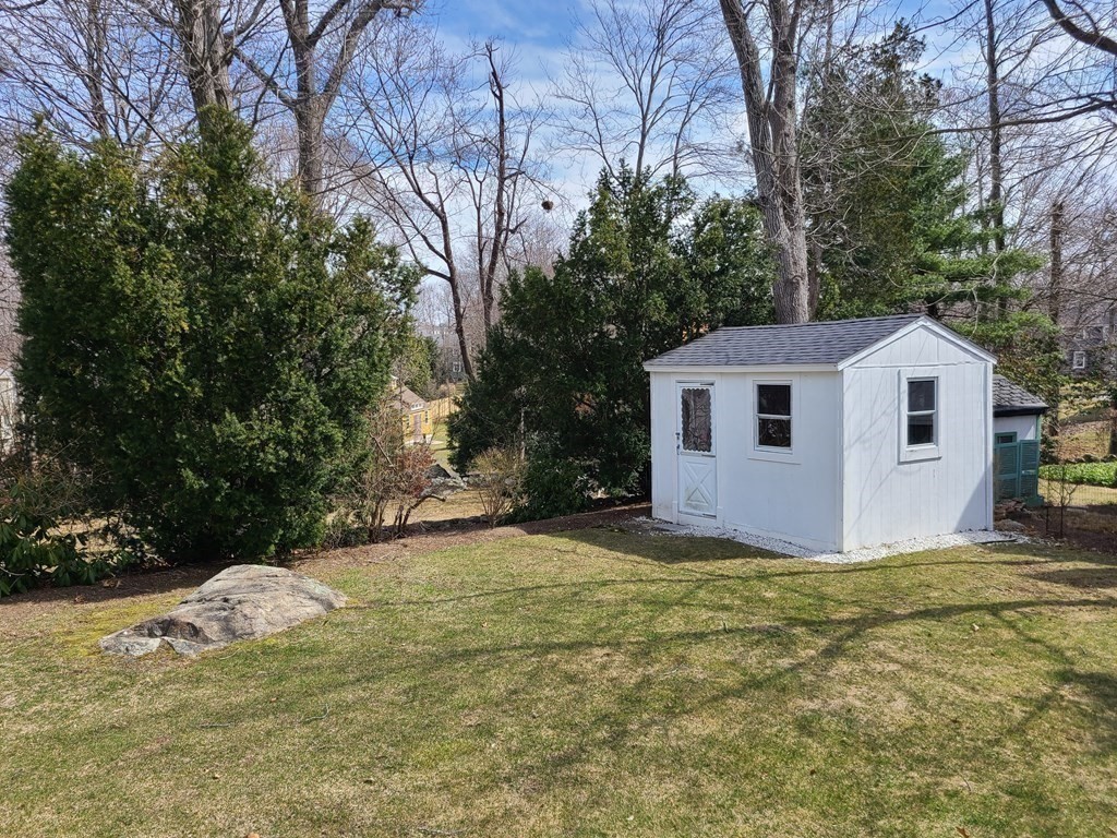 1 Lexington Circle Canton, MA 02021 - Photo 39 of 41 a view of a white house with a yard