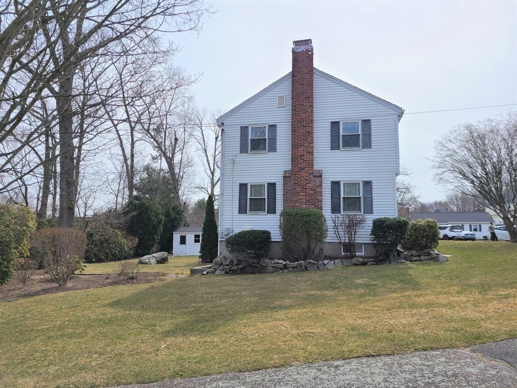 1 Lexington Circle Canton, MA 02021 - Photo 41 of 41 a front view of a house with a yard