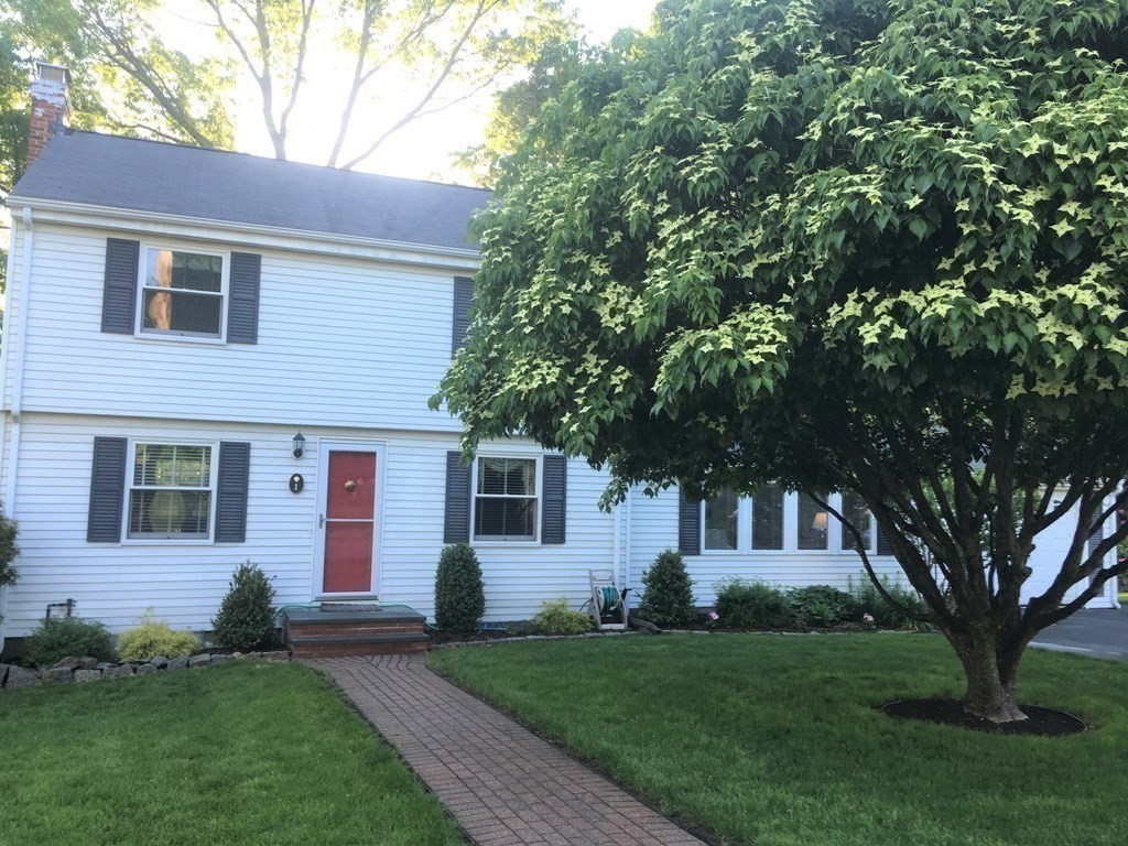 1 Lexington Circle Canton, MA 02021 - Photo 5 of 41 a front view of a house with a garden