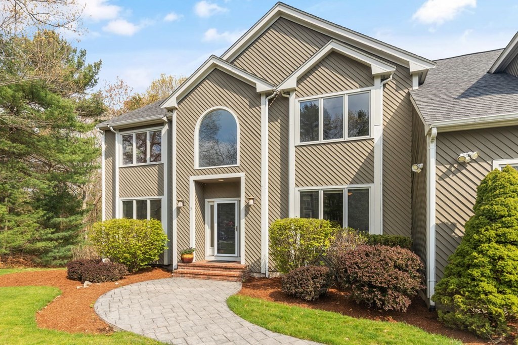 7 Wadsworth Way Sharon, MA 02067 - Photo 2 of 42 a front view of a house with garden
