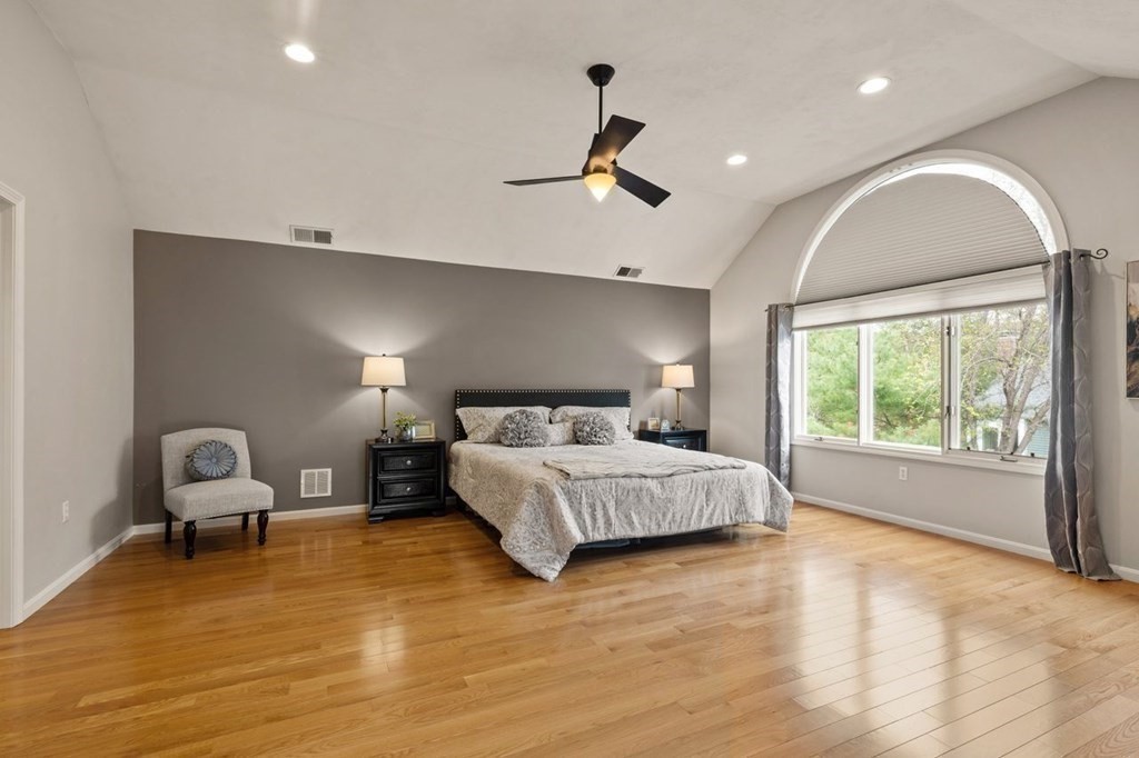 7 Wadsworth Way Sharon, MA 02067 - Photo 27 of 42 a spacious bedroom with a bed couch and window