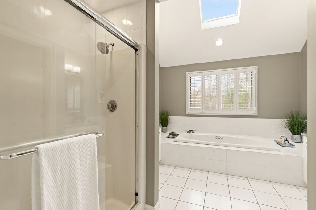 7 Wadsworth Way Sharon, MA 02067 - Photo 30 of 42 a spacious bathroom with a tub shower and a sink