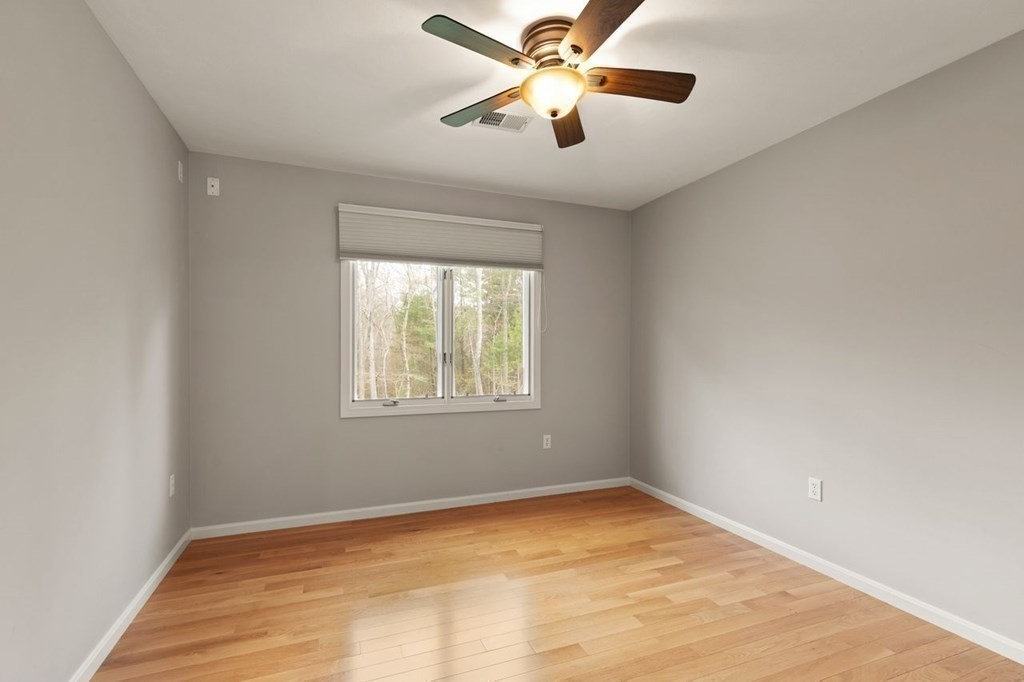 7 Wadsworth Way Sharon, MA 02067 - Photo 33 of 42 an empty room with a window and a fan