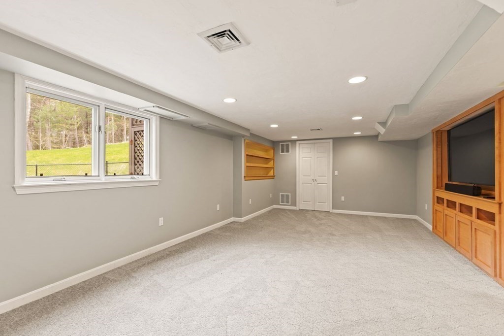 7 Wadsworth Way Sharon, MA 02067 - Photo 35 of 42 a view of an empty room with a window