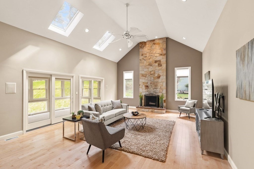 7 Wadsworth Way Sharon, MA 02067 - Photo 9 of 42 a living room with furniture and large windows