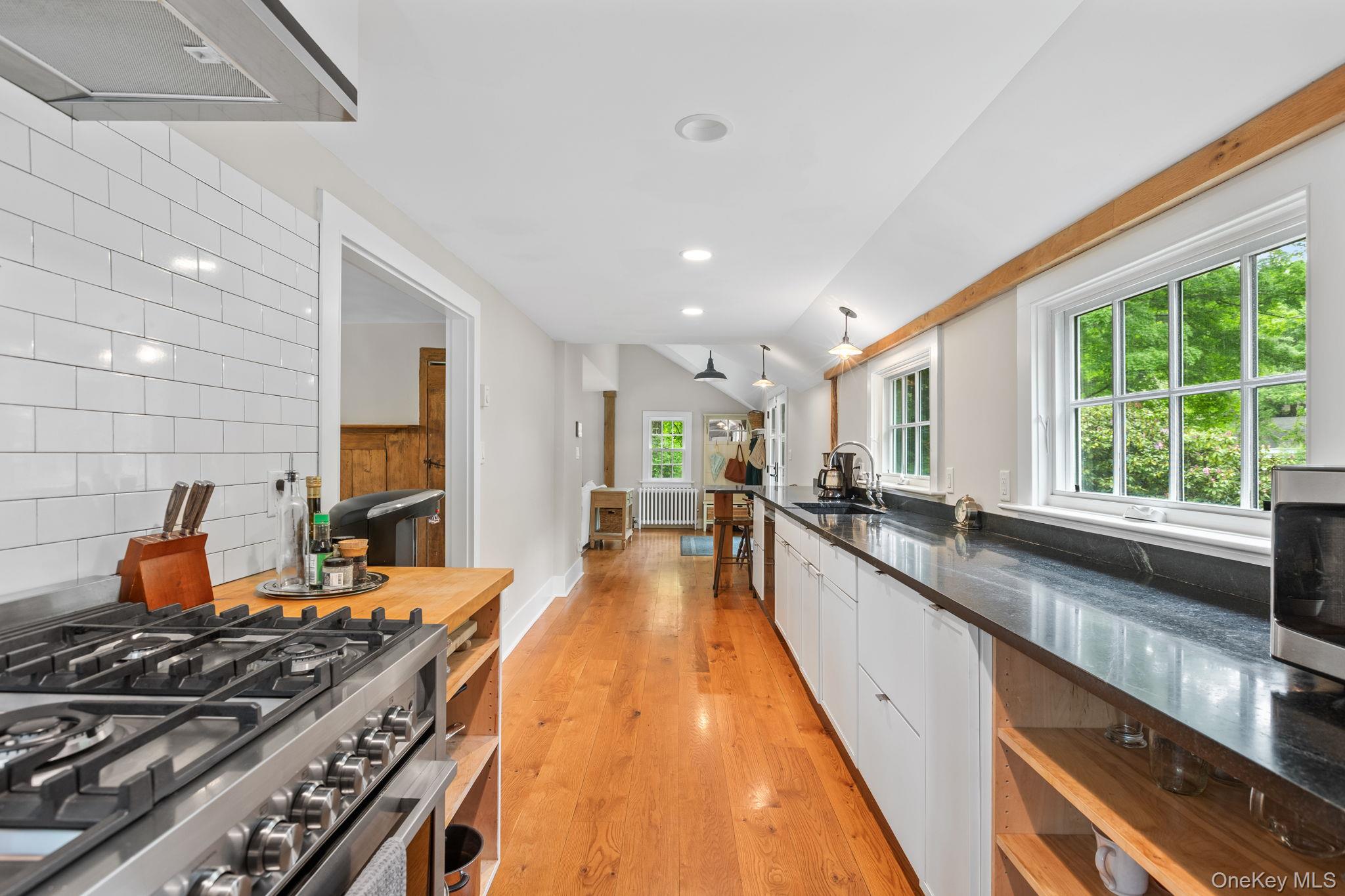 23 Pound Ridge Road Pound Ridge, NY 10576 - Photo 16 of 40 a large kitchen with stainless steel appliances granite countertop a lot of counter space and a large window