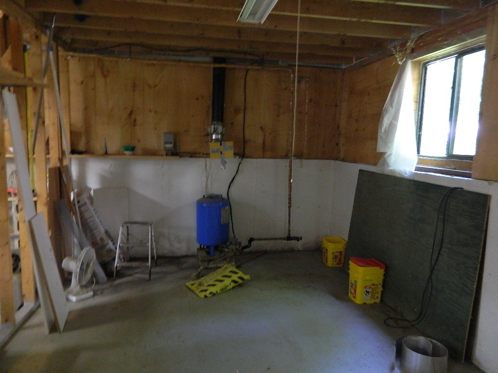 220 Captain Whitney Road Becket, MA 01223 - Photo 14 of 16 a room with water heater and a window