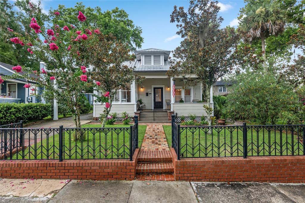 728 Southeast 8th Street Ocala, FL 34471 - Photo 1 of 1 a front view of a house with a garden