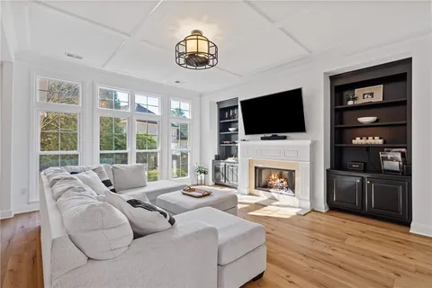 a kitchen with granite countertop cabinets stainless steel appliances and a sink