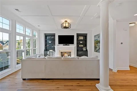 a view of a dining room with furniture window and wooden floor