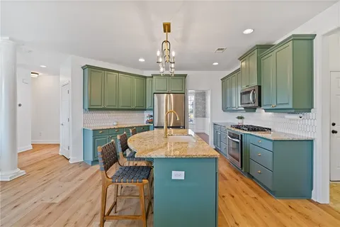 a bedroom with a bed and a lamp next to a window
