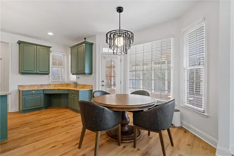 a bedroom with a bed a dresser and a window