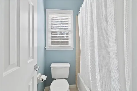 a white bath tub sitting next to a window