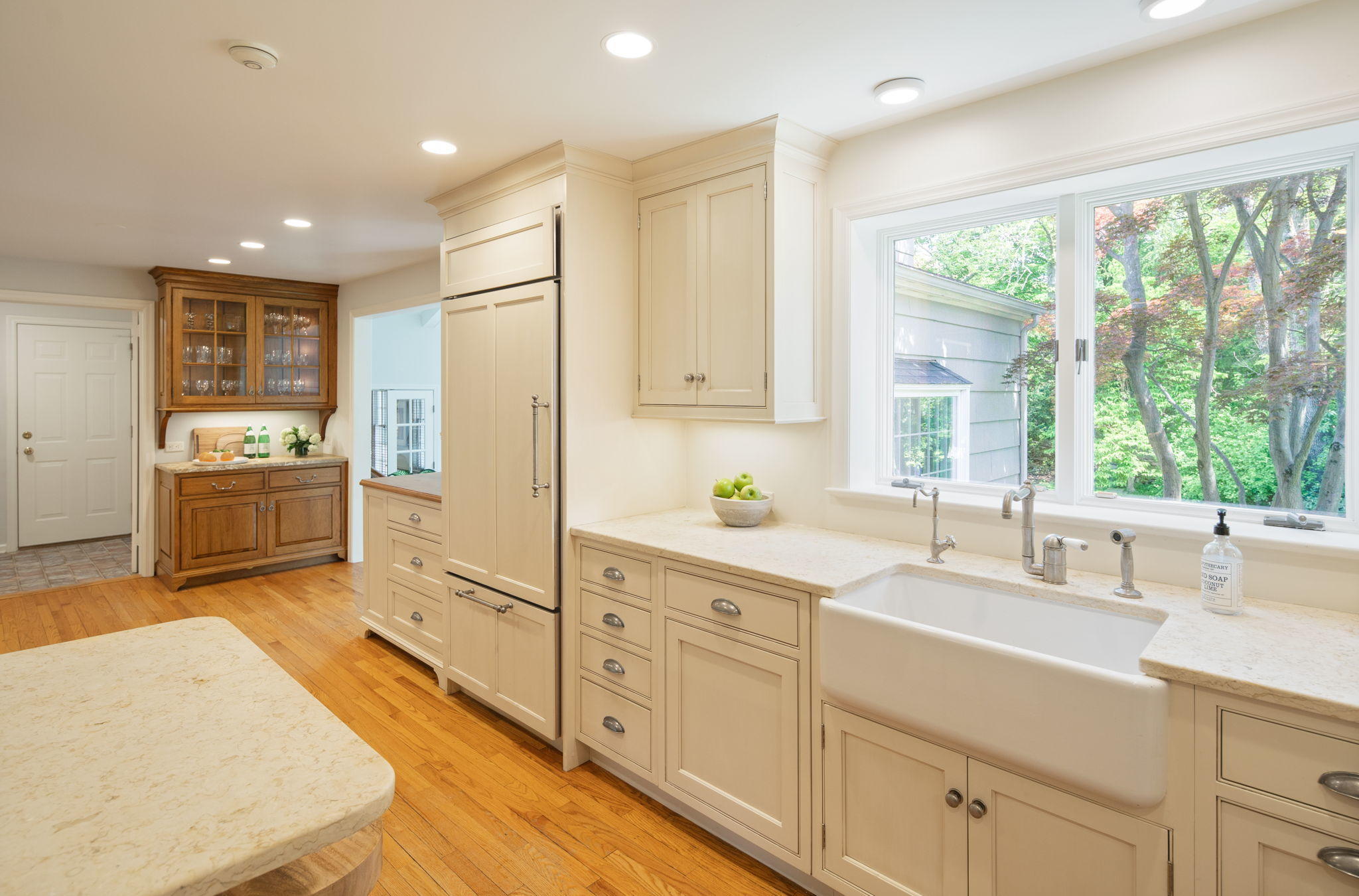 17 Wilson Ridge Road Darien, CT 06820 - Photo 14 of 37 a kitchen with white cabinets and wooden floors