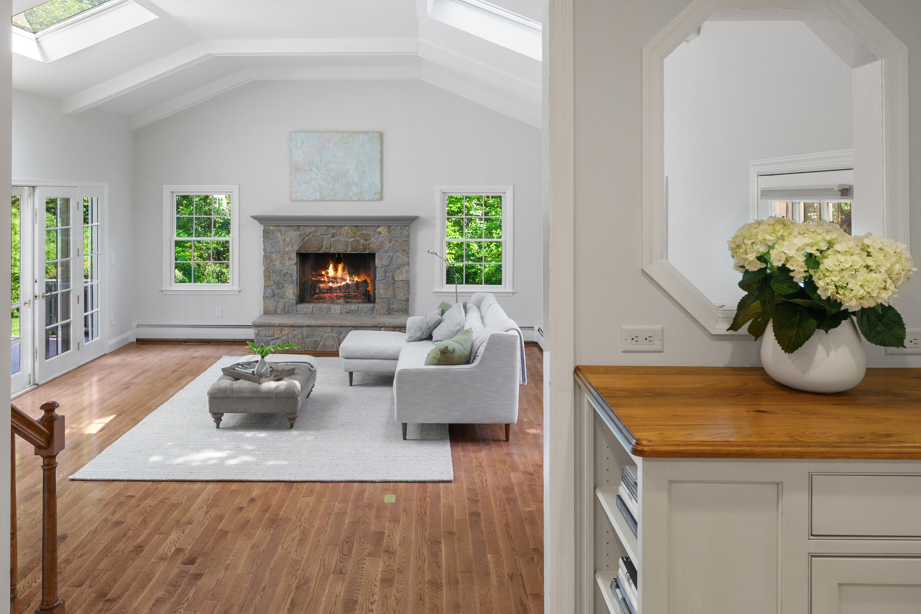 17 Wilson Ridge Road Darien, CT 06820 - Photo 16 of 37 a living room with furniture potted plant and a fireplace