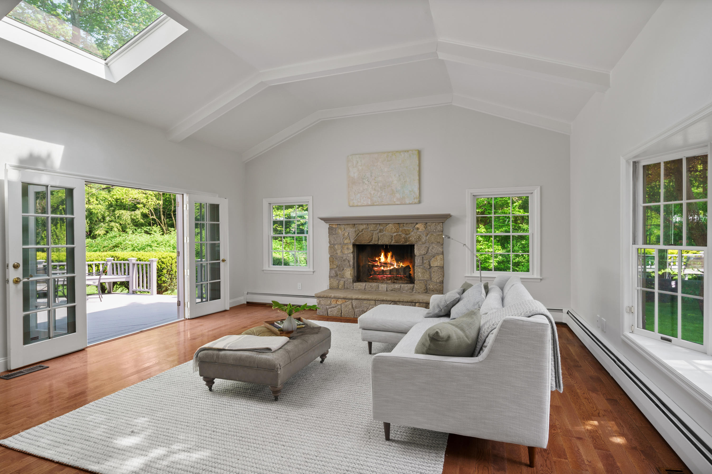 17 Wilson Ridge Road Darien, CT 06820 - Photo 18 of 37 a living room with furniture and a fireplace