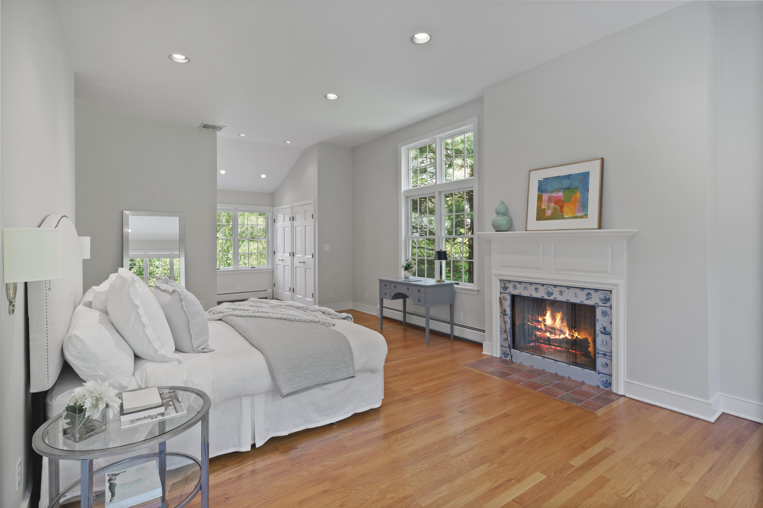 17 Wilson Ridge Road Darien, CT 06820 - Photo 23 of 37 a spacious bedroom with a balcony a bed and a fireplace