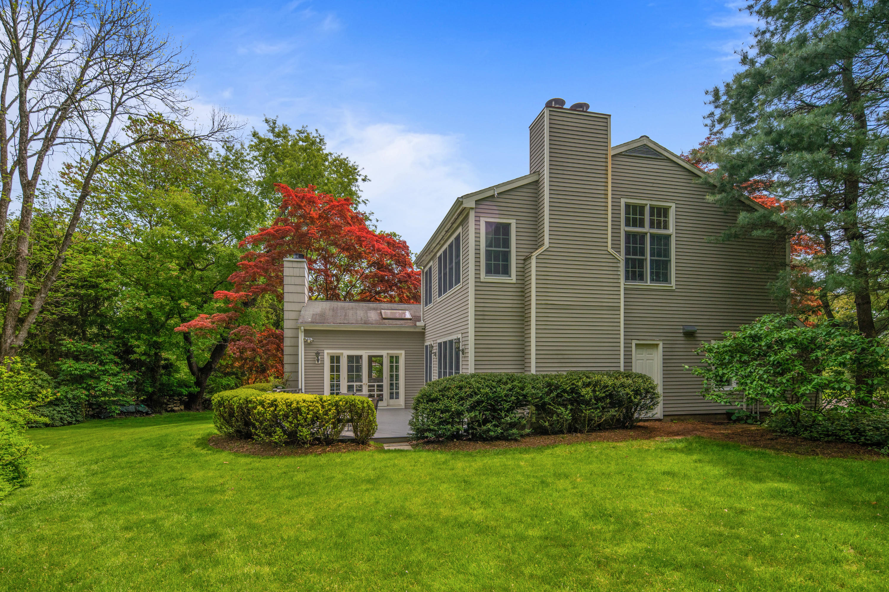 17 Wilson Ridge Road Darien, CT 06820 - Photo 35 of 37 a front view of a house with a garden