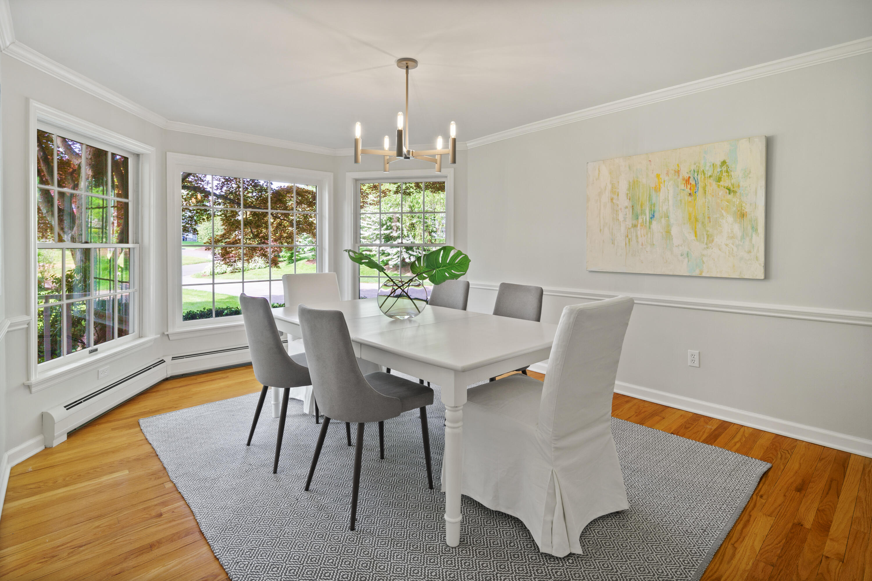 17 Wilson Ridge Road Darien, CT 06820 - Photo 10 of 37 a view of a dining room with furniture a chandelier and wooden floor